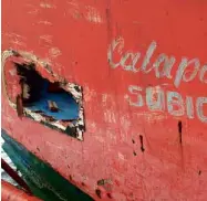  ?? ALLAN MACATUNO/INQUIRER SOUTHERN LUZON ?? BACK HOME The fishing boat FB Bubhoy (left) back at Subic on Saturday with a hole on its hull (above) from ramming by Chinese Coast Guard rubber boats.