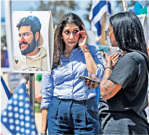  ?? ?? Suella Braverman sheds a tear at the site of the Oct 7 Supernova festival massacre, in Israel, alongside Mazal Tazazo, an Ethiopian Jew who survived the attack