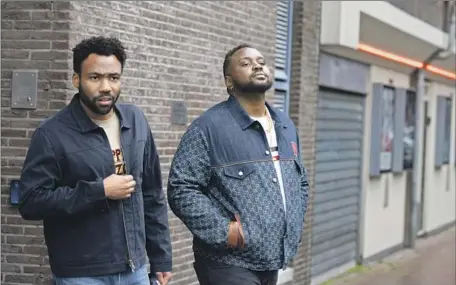  ?? DONALD GLOVER, Coco Olakunle FX ?? left, stars as the manager of his cousin Al, a.k.a. the rapper Paper Boi, played by Brian Tyree Henry, in “Atlanta.”