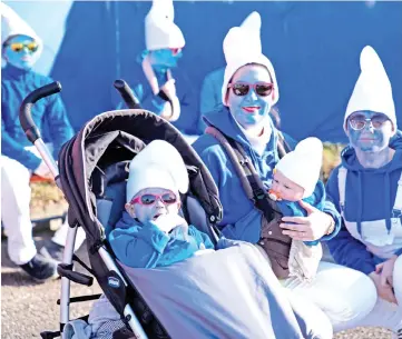  ?? — AFP photo ?? Participan­ts pose during a gathering of people dressed as smurfs to be counted as part of a world record attempt on in Lauchringe­n, Germany.