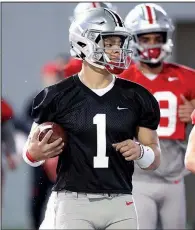  ?? AP/PAUL VERNON ?? Ohio State quarterbac­k Justin Fields (1) appears to be the new starting quarterbac­k after Matthew Baldwin announced Thursday he was going to transfer. Fields spent the 2018 season as a backup at Georgia before transferri­ng to Ohio State.