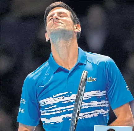  ??  ?? Novak Djokovic feels the pain on his way to defeat at the O2 Arena.