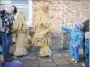  ?? PHOTO: GETTY IMAGES ?? Two of the three Straw Bears stop for a rest during the annual Whittlesea Straw Bear Festival parade in Whittlesey, England. The traditiona­l event was revived in 1980 and features a "Straw Bear" and its children being led through the village, near...