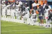  ?? JIM MONE — THE ASSOCIATED PRESS ?? Members of the Titans take part in the national anthem before a game against the Vikings on Sunday in Minneapoli­s.