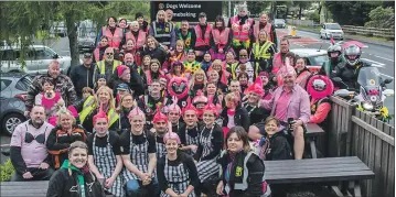  ??  ?? The pink- clad bikers gather in Tyndrum.