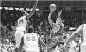  ?? NELSON CHENAULT/ USA TODAY SPORTS PHOTO ?? Scottie Wilbekin ( 5) scored a team- high 18 points to help No. 2 Florida earn a 75- 71 road win over Ole Miss.