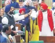  ??  ?? FALLING SHORT OF BLOWS: A video grab of local bodies minister having a heated argument with Akali leader Bikram Majithia during the budget session in the Vidhan Sabha on Monday.
