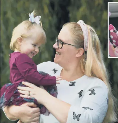  ?? PICTURES: JONATHAN GAWTHORPE ?? BATTLE: Felicity Birks with her mother Charlie. The one- year- old had a five per cent chance of survival when she was born.