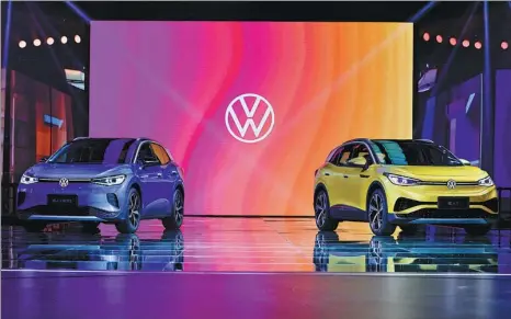  ?? PHOTOS PROVIDED TO CHINA DAILY ?? Volkswagen unveils its first China-made MEB-based vehicles, the ID.4 CROZZ and the ID.4 X, on Tuesday in Shenzhen, marking further efforts to realize the German carmaker’s ambition to become the most popular new energy vehicle brand in the country.