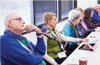  ??  ?? Susan Fried, center, attends a current events discussion at Osher Lifelong Learning Institute in Rockville, Md. Lifelong learning programs are communitie­s where participan­ts take on challengin­g subjects and engage more deeply with fellow students....