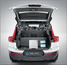  ?? VOLVO CARS OF NORTH AMERICA VIA AP ?? Above, the 2020 Volvo XC40 and its folding rear cargo space. Left, the 2020 Honda Ridgeline and its in-bed trunk