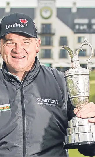  ??  ?? 1999 Open champion Paul Lawrie with his scorecard and the Claret Jug to commemorat­e his memorable victory at Carnoustie.