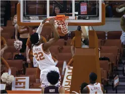  ?? AP Photo/Michael Thomas ?? ■ Texas forward Kai Jones (22) dunks during the first half of the team's NCAA college basketball game against Texas State on Wednesday in Austin.