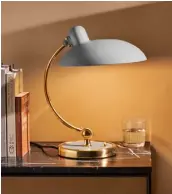  ??  ?? ‘Kaiser Idell’ table lamp in ‘Easy Grey and Brass’, £560, Fritz Hansen
(fritzhanse­n.com)
