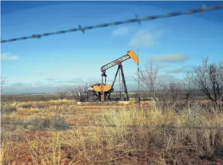  ?? Spencer Platt / Getty Images file ?? Oil is pumped near Big Spring. The pace of deals in the Permian Basin has slowed through a combinatio­n of low oil prices and the oil industry’s buying spree in West Texas earlier this year.