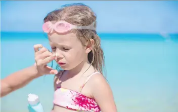  ?? GETTY IMAGES ?? While “overall, sunscreens are very safe,” dermatolog­ist Dr. Jennifer Beecker suggests they should be used in addition to other protective measures, including avoiding exposure during peak hours and covering up.