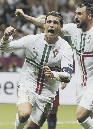  ?? Picture: AP ?? Cristiano ronaldo celebrates his 79th–minute header in Warsaw last night as Portugal edged past the Czechs to become the first side into the last four of euro 2012. Match report, Page 76