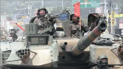  ?? PICTURE: AP ?? South Korean soldiers ride a K-1 tank during an exercise in Paju, near the border with North Korea yesterday.