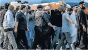  ?? Picture: CARL COURT/GETTY IMAGES ?? LAID TO REST: A coffin containing the body of a victim of the Christchur­ch mosque attacks is carried for burial at the Memorial Park Cemetery in Christchur­ch