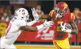  ?? Jayne Kamin-Oncea Getty Images ?? DEVON WILLIAMS, right, finished with one catch for 11 yards against Stanford, the only catch in the first two games for the former four-star recruit.