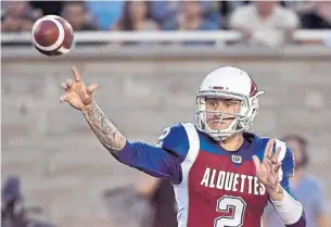  ?? PAUL CHIASSON/THE CANADIAN PRESS ?? Johnny Manziel threw four intercepti­ons and a meagre 104 yards in his debut.