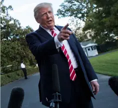  ??  ?? President Donald Trump speaks with reporters outside the White House prior to his departure aboard Marine One. The viral spread of hoaxes and misinforma­tion ahead of the US election and Brexit referendum two years ago was a wake-up call for many...