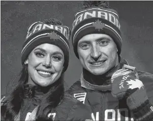  ?? THE CANADIAN PRESS/AP-CHARLIE RIEDEL ?? Gold medallists Tess Virtue and Scott Moir pose during their medals ceremony at the 2018 Winter Olympics in Pyeongchan­g, South Korea, Feb. 20. Virtue and Moir are among the retired all-star athletes hitting the road for a thank-you tour and will be in...