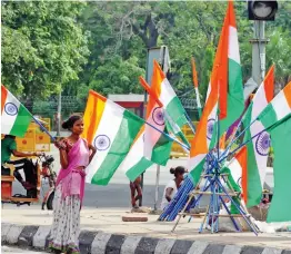  ?? — BIPLAB BANERJEE ?? A roadside vendor wait for customer at a stall in New Delhi on Friday, the eve of the country’s 74th Independen­ce Day.