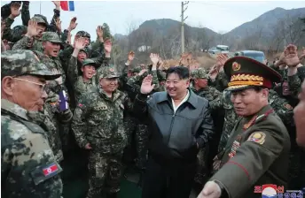  ?? — KCNA VIA KNS / AFP photo ?? Kim Jong Un (centre) inspects the First Tank Armored Infantry Regiment, which is under the direct control of the Seoul Ryu Kyong Su Guards 105th Tank Division of the Korean People’s Army (KPA) at an undisclose­d location in North Korea.