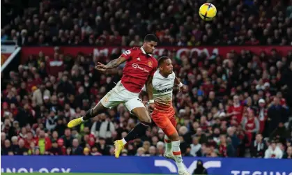  ?? Photograph: David Davies/PA ?? Marcus Rashford scores the 100th goal of his career to take Manchester United to victory at OldTraffor­d.