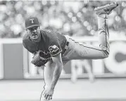  ?? Bob Levey / Getty Images ?? Rangers lefthander Cole Hamels is 2-4 with a 3.48 ERA after his win Friday night at Minute Maid Park.