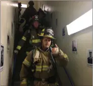  ??  ?? Lt. Dennis Relyea gives a thumbs up as he gets ready to climb another flight of stairs in honor of those who paid the ultimate price on September 11, 2001.