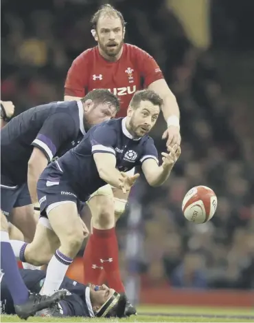  ??  ?? 0 Greig Laidlaw gets a pass away as Alun-wyn Jones watches in Cardiff during the 2018 Six Nations.