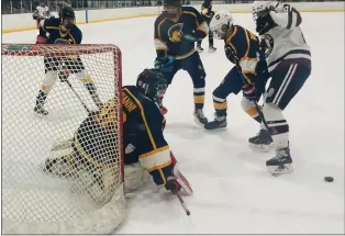  ?? KEV HUNTER — MEDIANEWS GROUP ?? Wiss goalie Michael Bonanni makes a save for the Trojans in their game with Abington on Thursday.