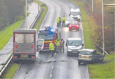  ??  ?? Emergency services at the scene of the accident in Kirkcaldy yesterday morning.