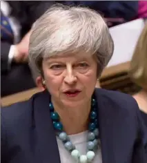  ??  ?? Theresa May, qui a annoncé le report du vote, se rendra à Bruxelles, jeudi pour faire valoir les préoccupat­ions des Britanniqu­es. (Photo AFP)