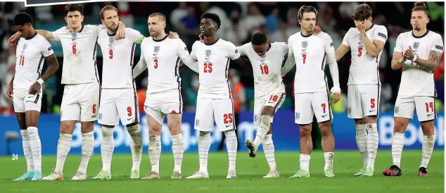  ??  ?? England captain Harry Kane (below, third from left) stands firm with his players during the penalty shoot-out, although Jadon’s despair after
missing his shot is clear as Gareth comforts him (top left)