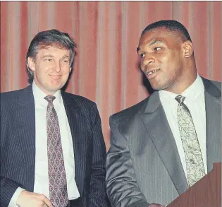  ?? FOTO: AP ?? Tyson junto a Trump, que fue su promotor en la pelea con Michael Spinks, en junio de 1988