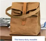  ?? ?? This heavy-duty, reusable brown paper bag, which a good friend gifted to Bension several years ago, “is my version of a lunch pail.” He eats lunch in the office most days, “a reflection of my attitude about working hard with laser focus on delivering results.”