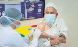  ?? HIMANSHU VYAS/HT PHOTO ?? An elderly man gets Covid vaccine shot at Government’s Harbux Kanwatiya Hospital in Jaipur.
