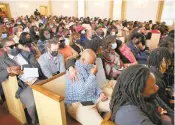  ?? ?? Roughly 450 mourners lined the pews of the Metropolit­an Funeral Home Chapel, with another hundred in an overflow chapel and dozens standing in the lobby and hallways.