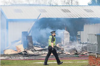  ?? Picture: Steve Macdougall. ?? The building housing Iain M Smith Actioneers at Perth Airport was set ablaze on March 9.