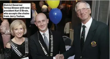  ??  ?? District Governer Teresa Dineen with new president Karl Ó Broin, who accepts the chains from Jerry Teehan.