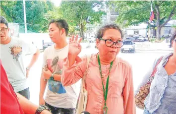  ??  ?? Karapatan members and the family of alleged rebel leader Rustico Tan storm the police headquarte­rs yesterday to look for the suspect, whom they claimed to have been kept from them.