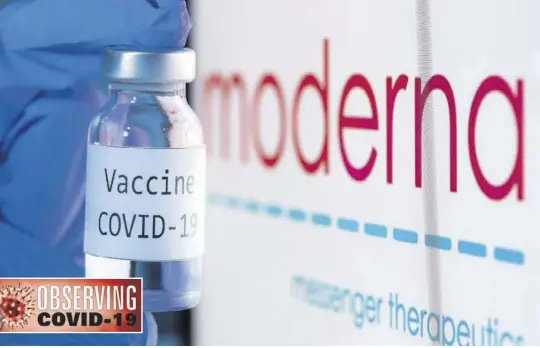  ??  ?? In this file photo taken on November 18, 2020 shows a bottle reading “Vaccine COVID-19” next to the Moderna biotech company logo.