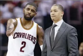  ?? THE ASSOCIATED PRESS ?? Cleveland Cavaliers’ Kyrie Irving talks with head coach Tyronn Lue during a playoff game against the Detroit Pistons in Cleveland. With Washington and Boston headed to a Game 7 on Monday, Cleveland’s break since sweeping Toronto in the second round...