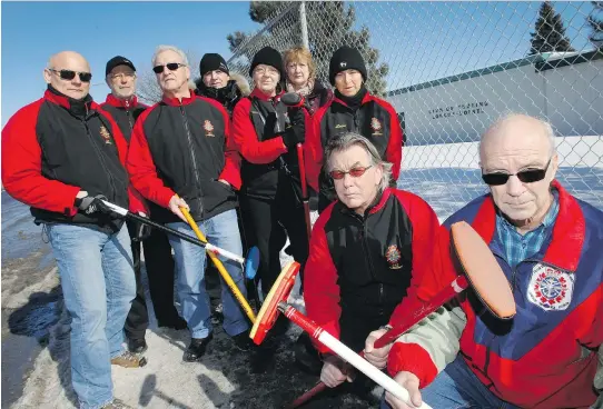  ?? MA R I E - F R A NC E C O A L L I E R ?? Nine members of les Sénateurs league, part of the Longue- Pointe Curling Club, pose with their curling brooms on Thursday in front of the facility on Longue- Pointe Military Base. Montreal’s east- end base is planning to close the rink, leaving many locals without a place to play. Among those upset are Yves Lafleur, l eft, René Voisard, Noel- Yves Perron, Michel Bouchard, Nicole Boyer, Marthe Desautels, Lucie Souliéres, Michel Marceau, president of the league, and Harry McCarty, at right.