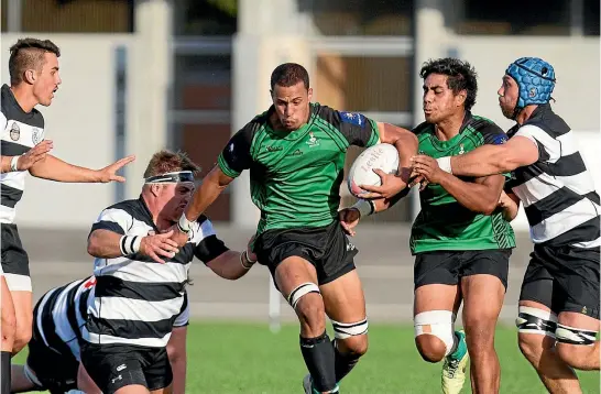  ?? PHOTO: FAIRFAX ?? Marist flanker Te Puoho Stephens takes on the Moutere defence during their 2016 game at Trafalgar Park, Nelson. The teams meet again at Awarua Park on Saturday.