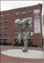  ??  ?? This May 11, 2017shows “The Iron Man” sculpture of a hockey player next to the Prudential Center where the New Jersey Devils hockey team plays in Newark.