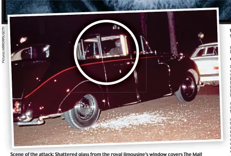  ?? ?? Scene of the attack: Shattered glass from the royal limousine’s window covers The Mall